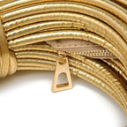 Gouden gedraaide handtas